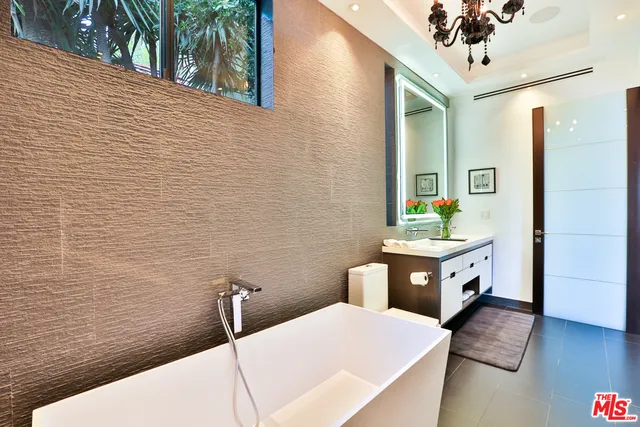 a bathroom with a bathtub and sink