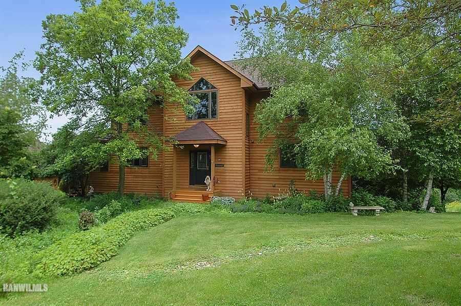 589 North Elizabeth Scales Mound Road Elizabeth, IL 61028 - Photo 1 of 1 a front view of house with yard and trees in the background