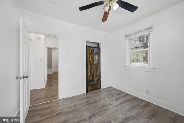 a view of a bathroom with a glass door and a bathroom