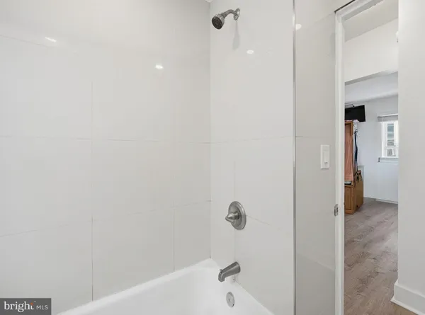 a room with a wooden floor and furniture