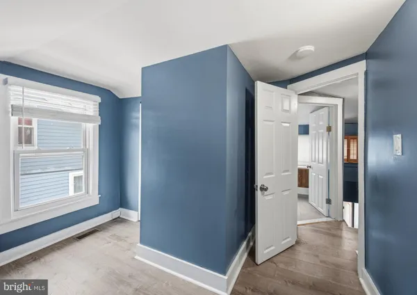 a kitchen with a refrigerator sink and cabinets