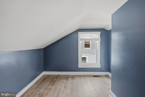 a kitchen with a refrigerator and a stove