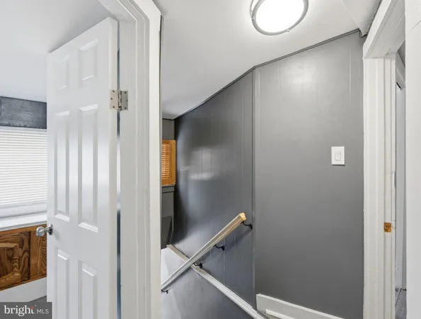 a spacious bathroom with a granite countertop sink a mirror and a vanity