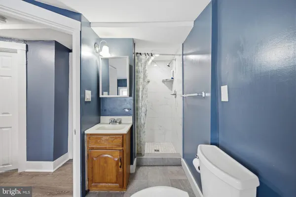 a room with a dresser and a wooden floor