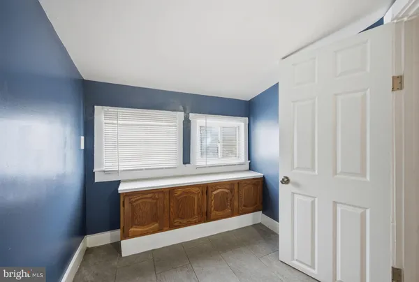 a white toilet sitting next to a shower curtain