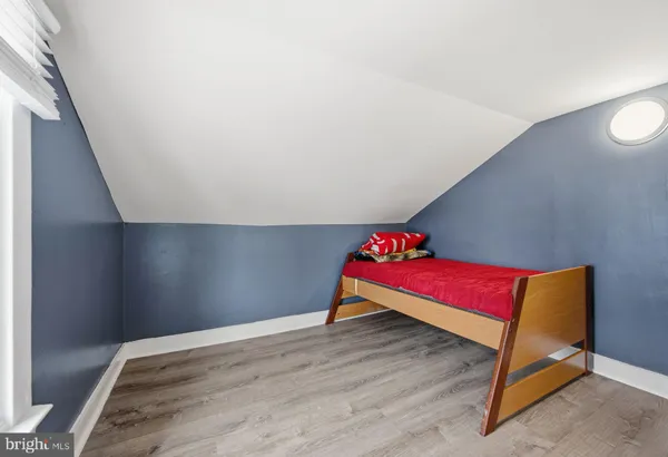 a room with a bed and a window