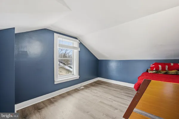 a view of balcony with wooden floor and fence