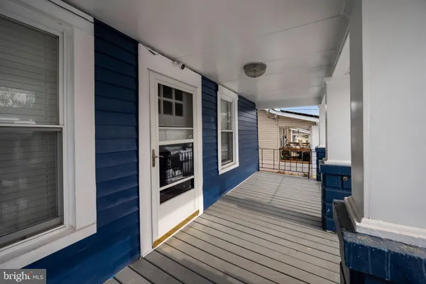 a view of a kitchen with a sink and wooden floor