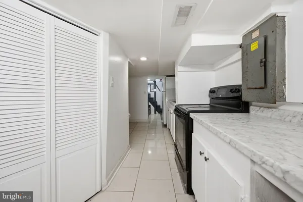 a view of a house with wooden fence