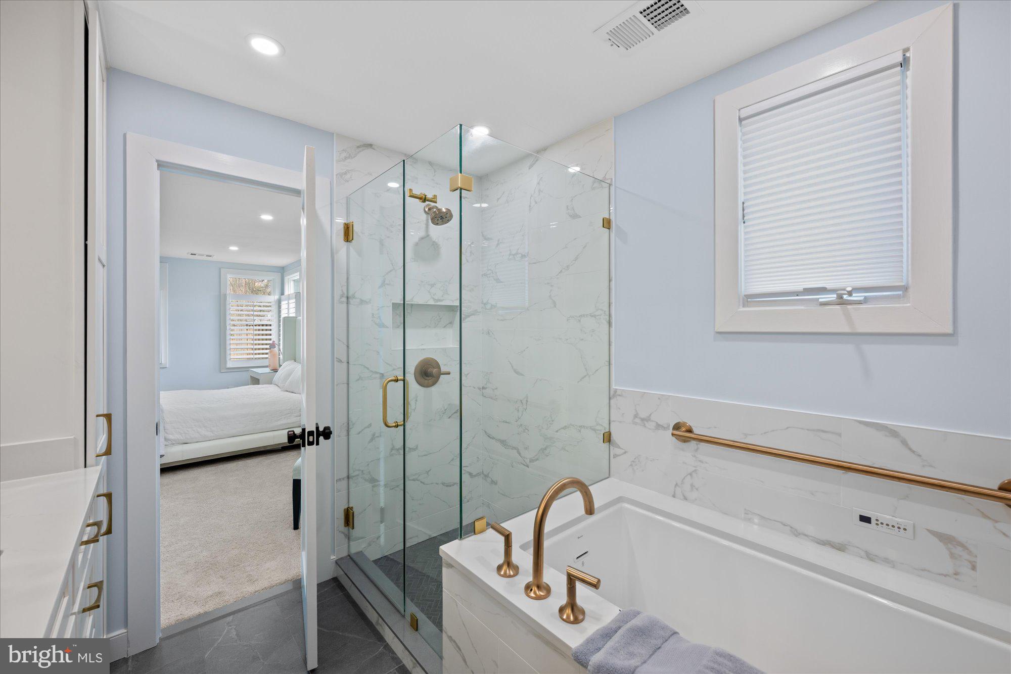 6700 Rannoch Road Bethesda, MD 20817 - Photo 22 of 36 a bathroom with a tub shower and sink