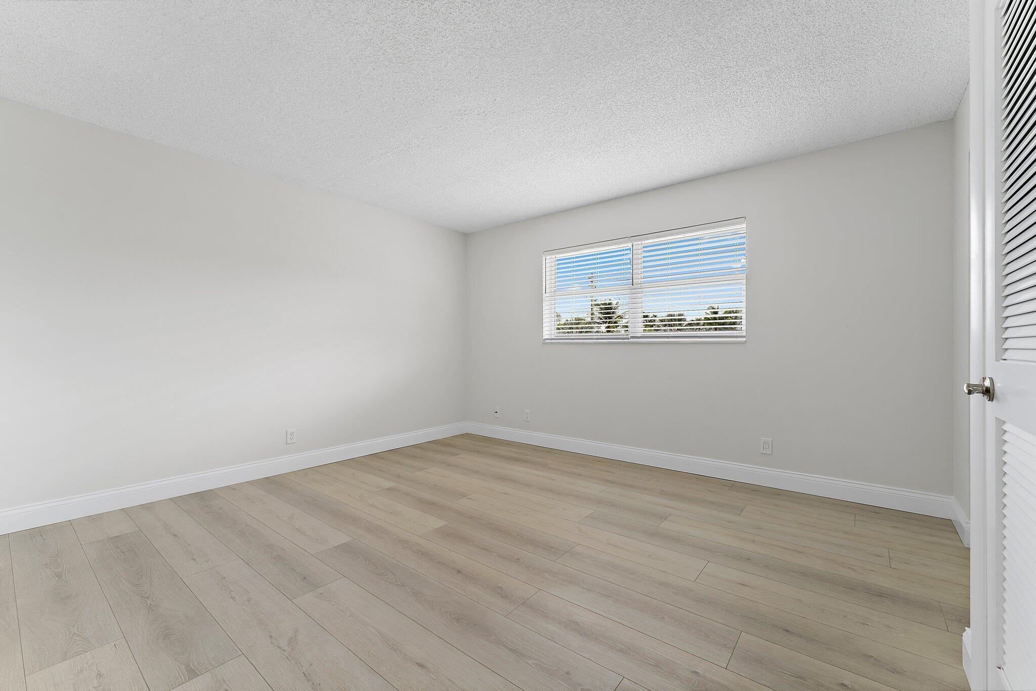 20 Celestial Way, Unit 215 Juno Beach, FL 33408 - Photo 17 of 25 an empty room with a window