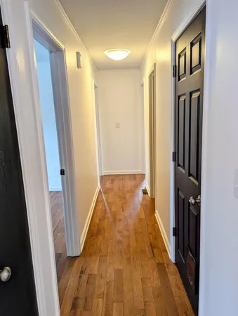 a view of a bathroom from the hallway