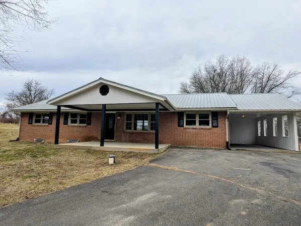 a house with trees in front of it
