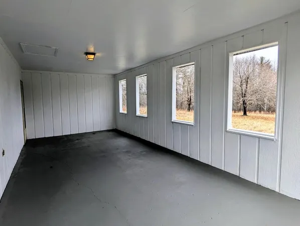 a backyard of a house with large trees