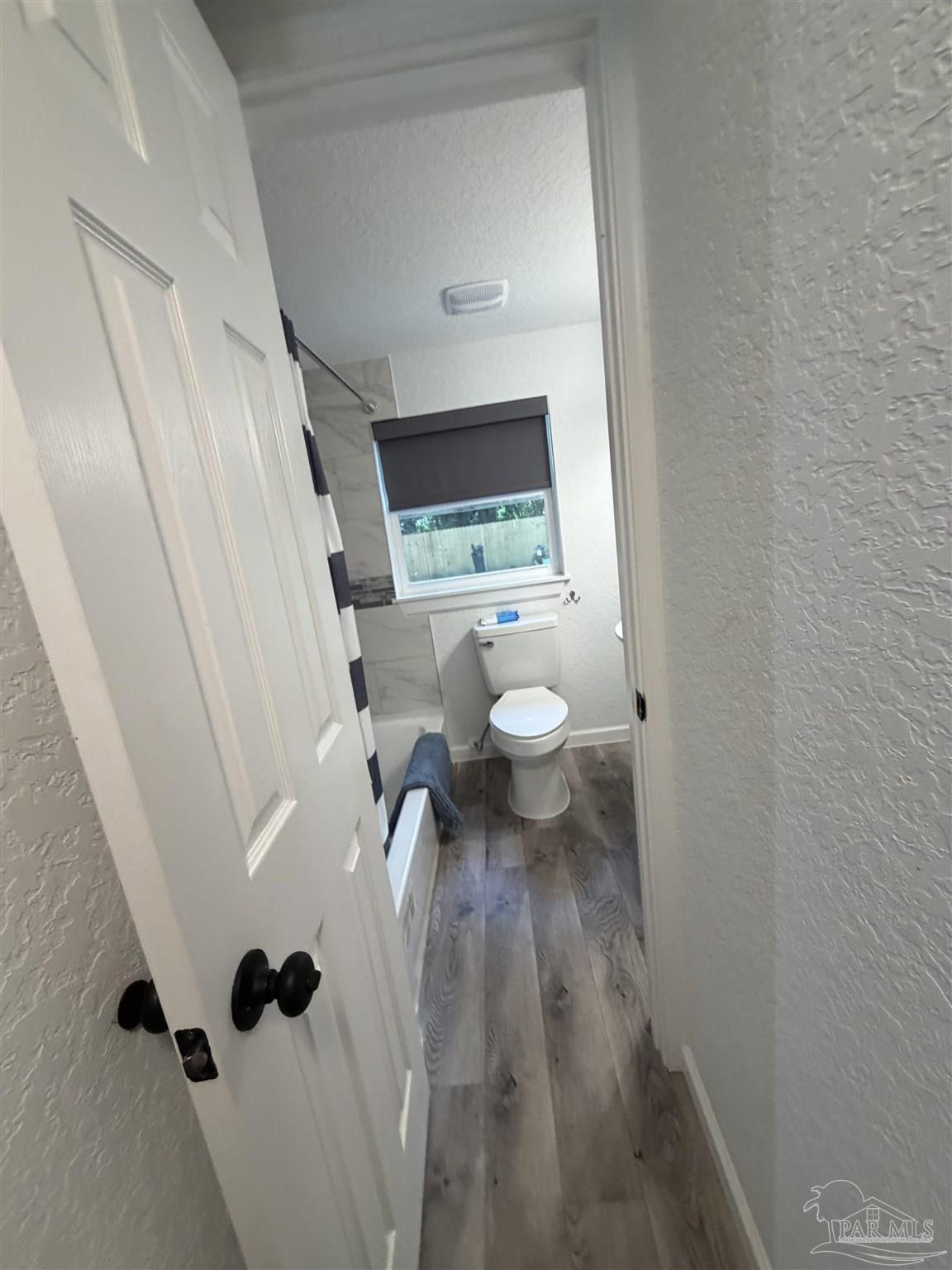4532 Limit Street Milton, FL 32583 - Photo 15 of 18 a view of bathroom with a sink and toilet in it