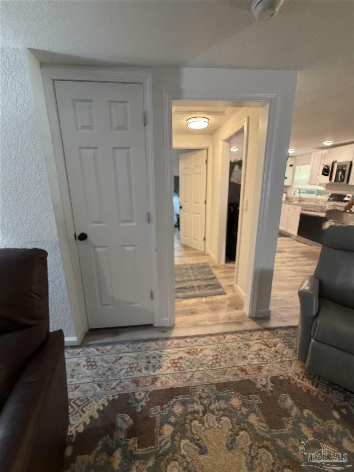4532 Limit Street Milton, FL 32583 - Photo 18 of 18 a view of a livingroom with wooden floor and furniture
