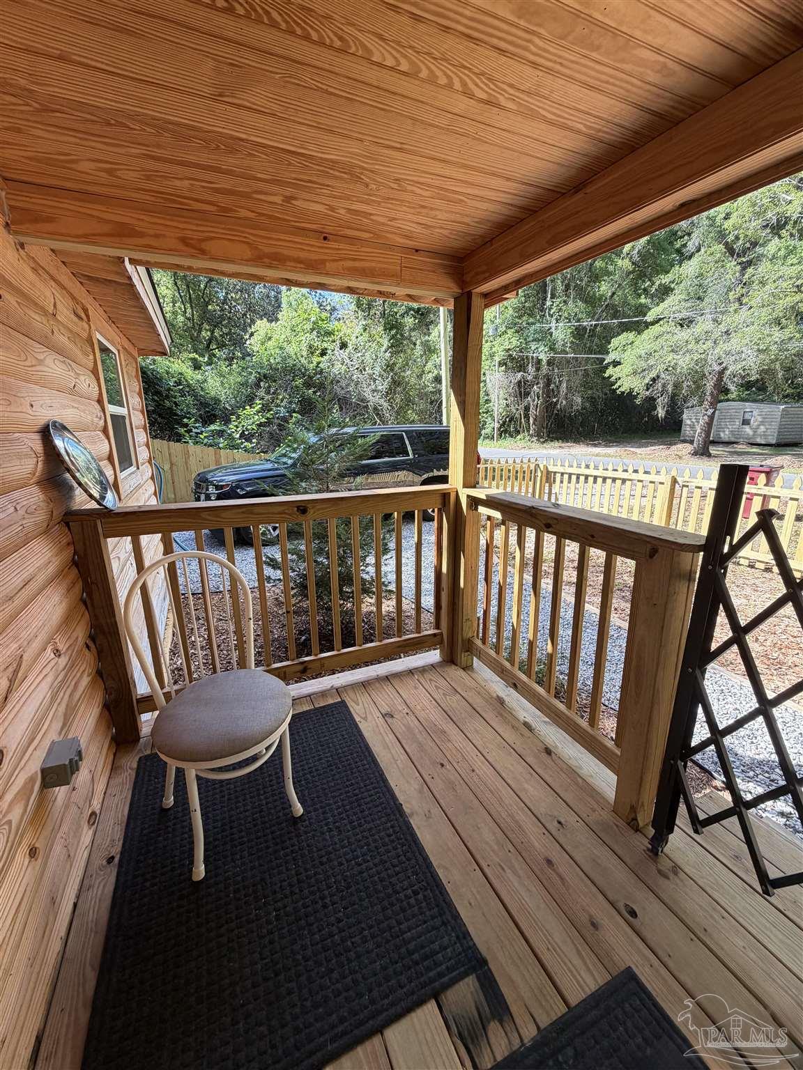 4532 Limit Street Milton, FL 32583 - Photo 2 of 18 a view of a balcony with wooden floor