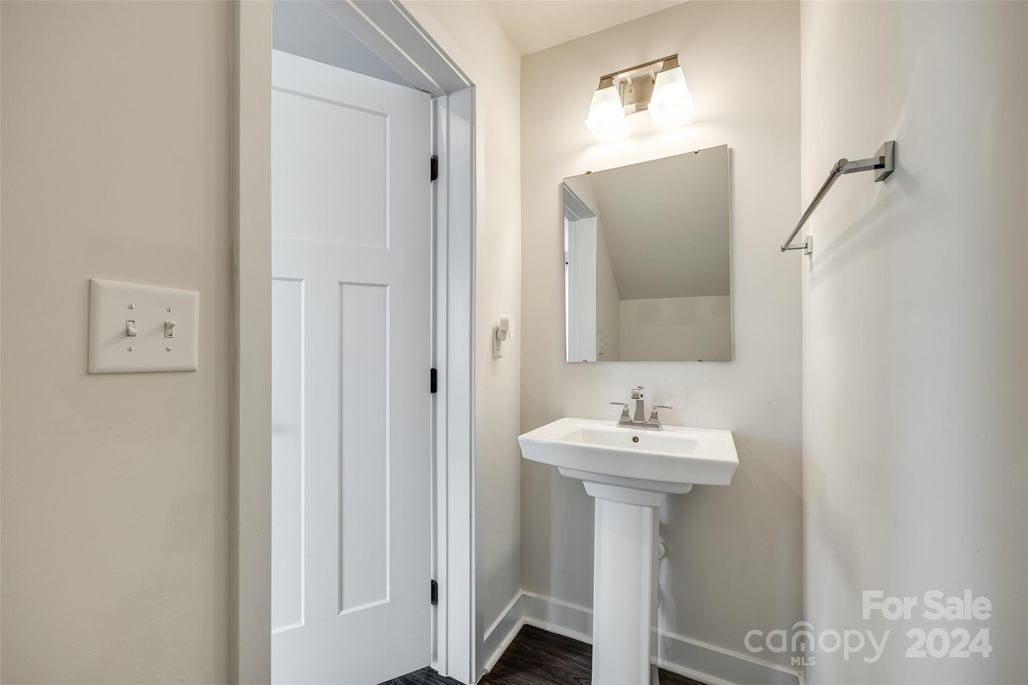 664 Crudent Road Tega Cay, SC 29708 - Photo 18 of 34 a bathroom with a sink and a mirror