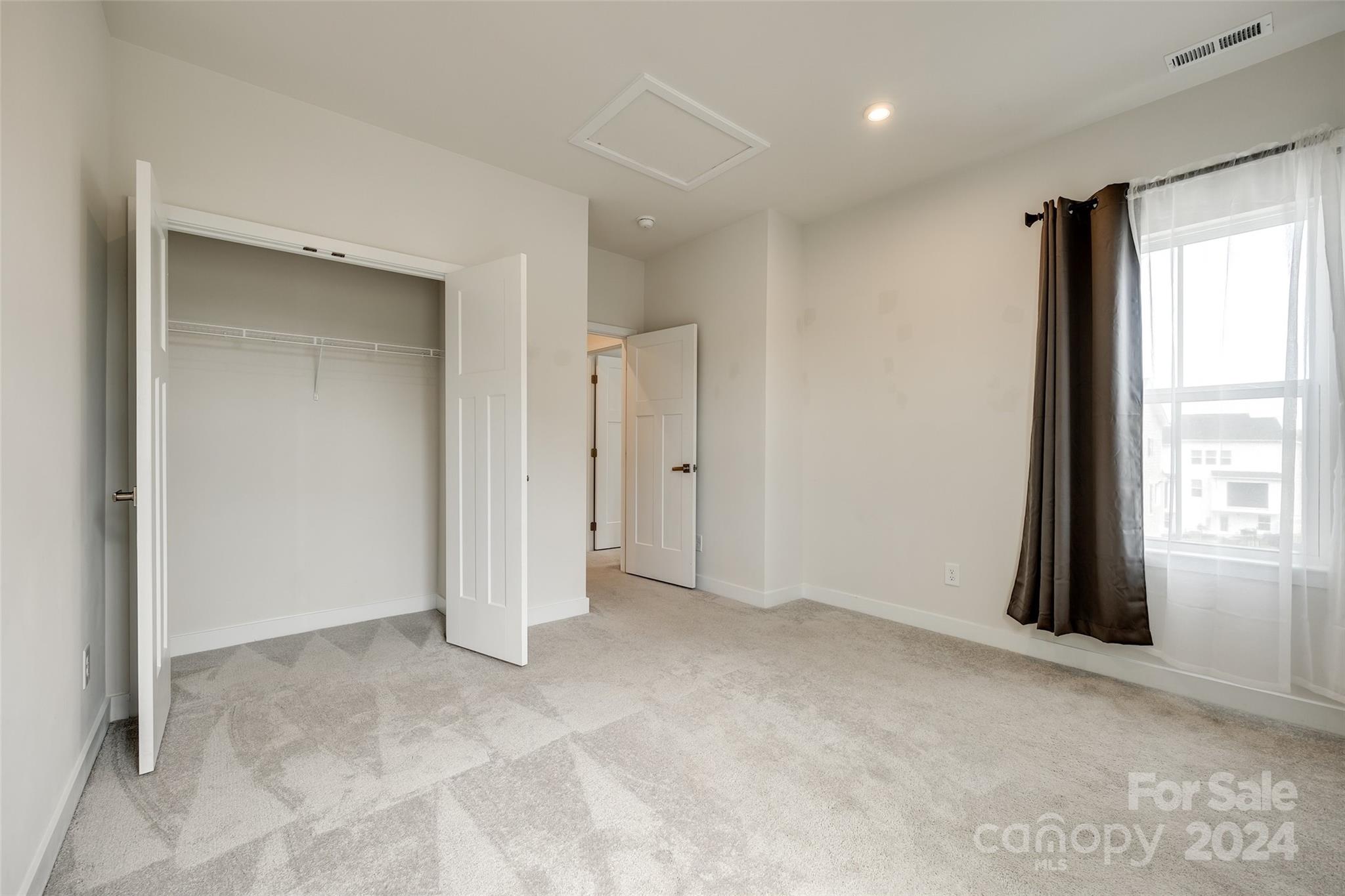 664 Crudent Road Tega Cay, SC 29708 - Photo 22 of 34 a view of an empty room with a window