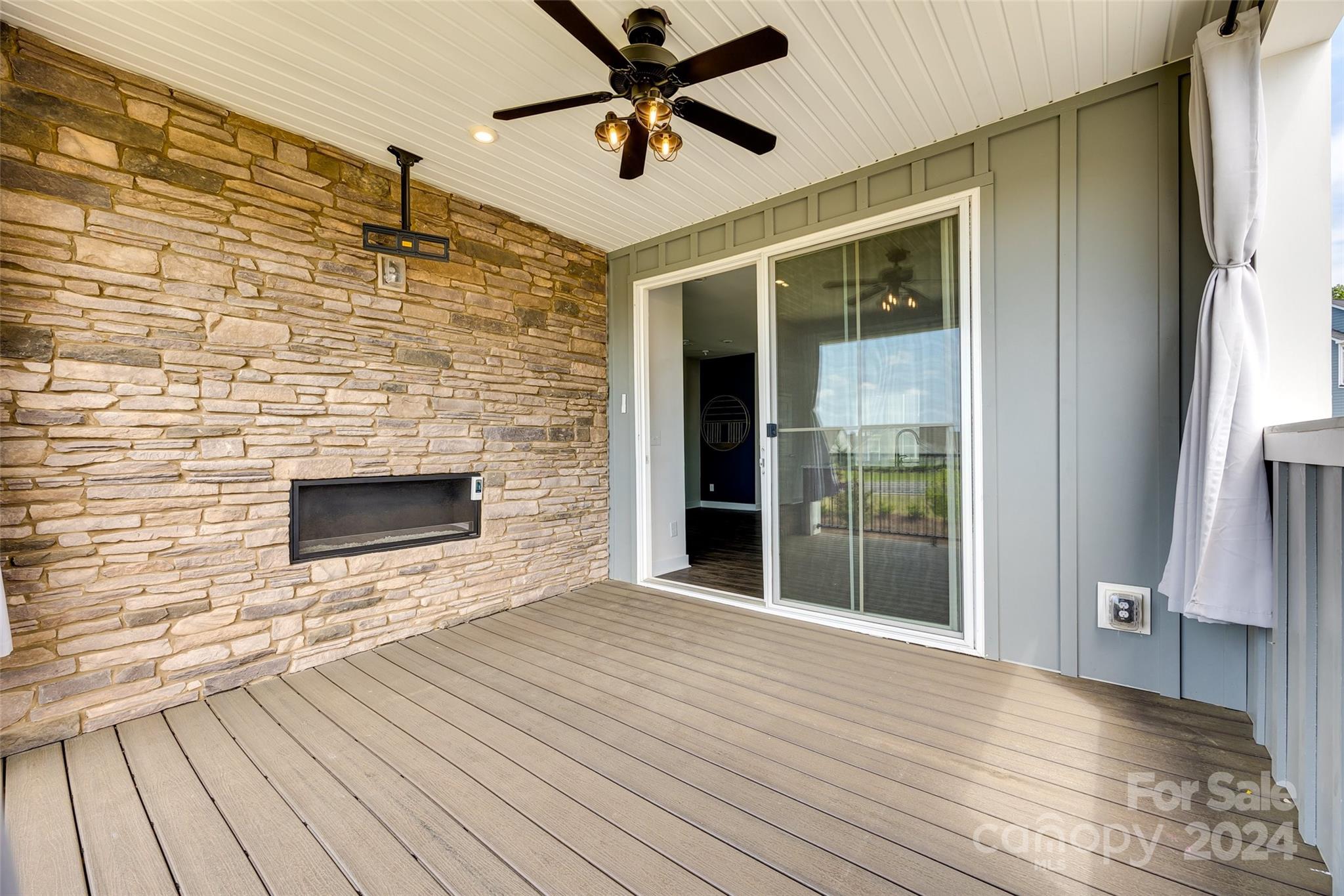 664 Crudent Road Tega Cay, SC 29708 - Photo 30 of 34 a view of a livingroom with wooden floor and a fireplace