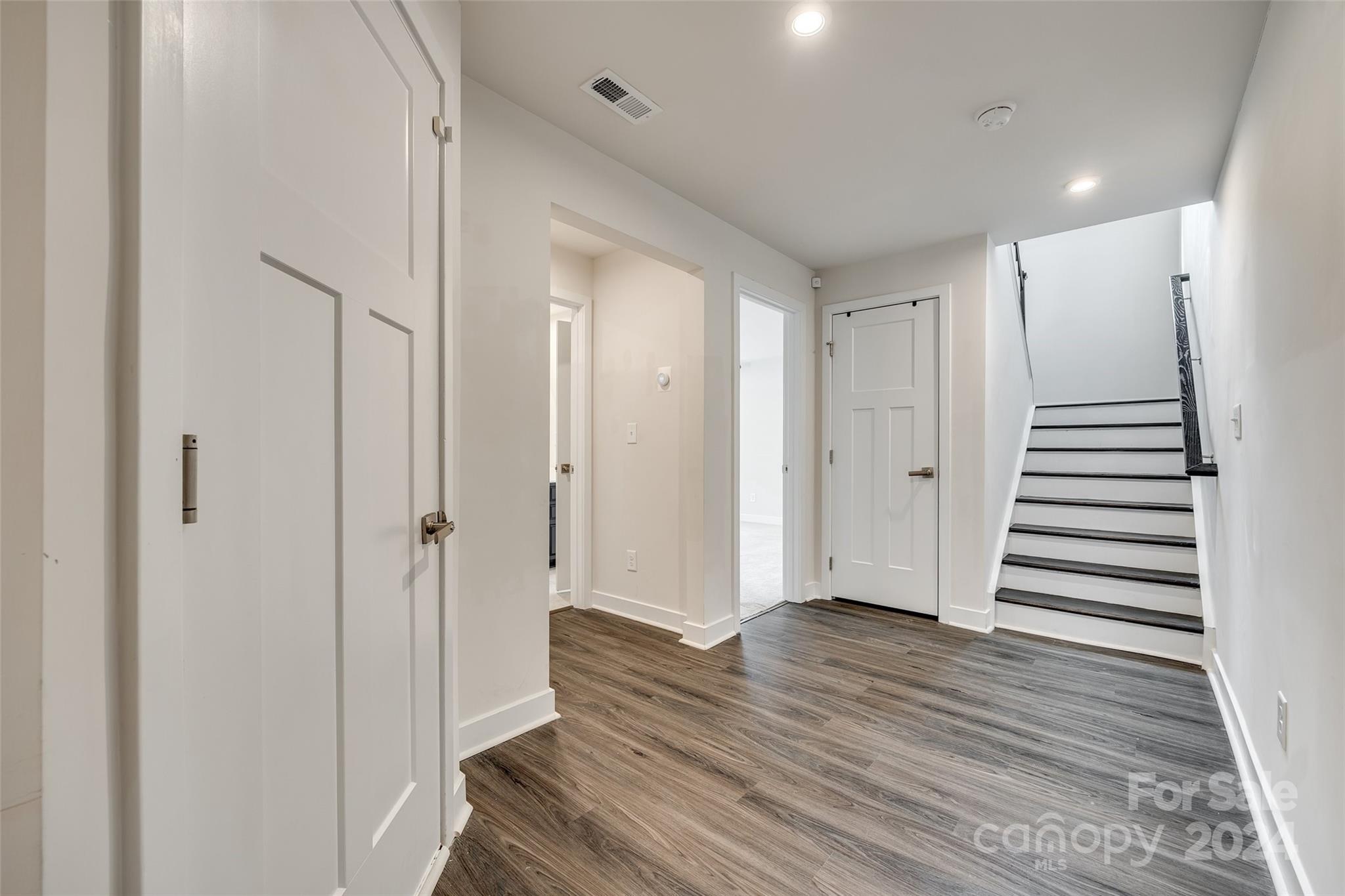 664 Crudent Road Tega Cay, SC 29708 - Photo 4 of 34 a view of a hallway with wooden floor