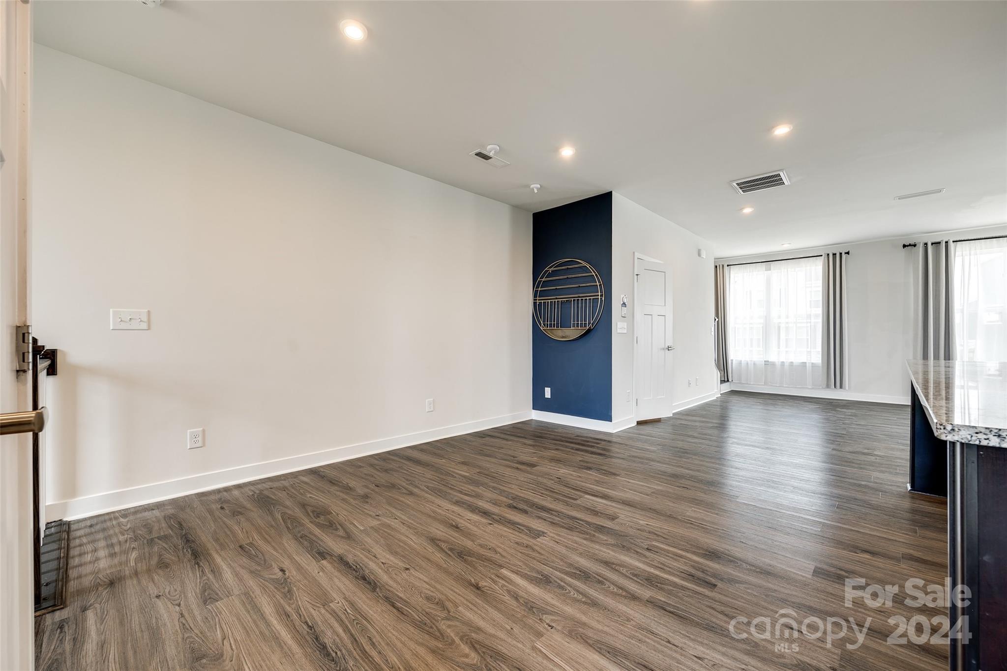 664 Crudent Road Tega Cay, SC 29708 - Photo 7 of 34 an empty room with wooden floor and window