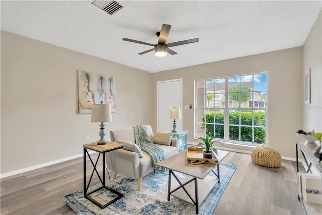 a living room with furniture and a window