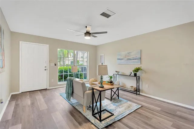 a workspace with wooden floor and a rug