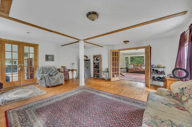 a bedroom with furniture and a window