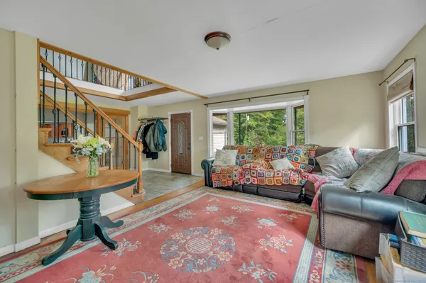 a bedroom with furniture and a window