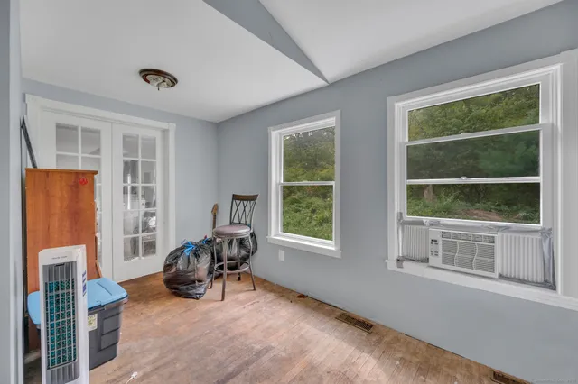 a bathroom with a sink toilet and a mirror