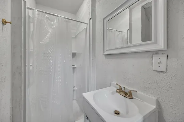 a view of a hallway with bench