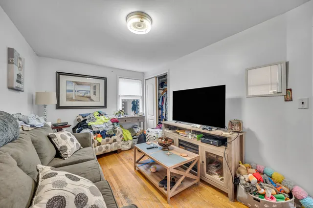 a bedroom with a bed and a mirror