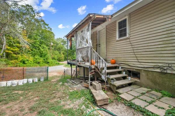 a kitchen with stainless steel appliances granite countertop a refrigerator sink and stove