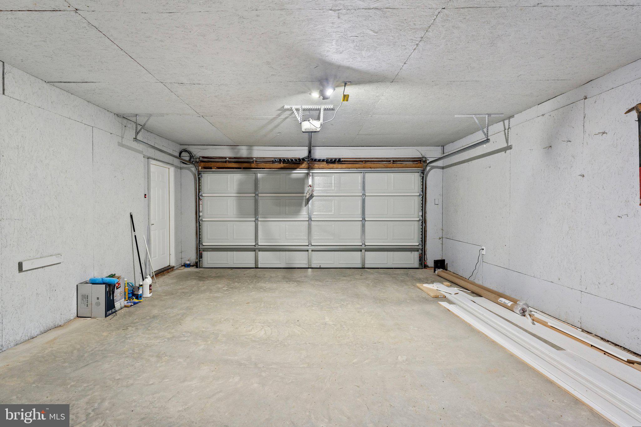 7855 Rogues Road Catlett, VA 20119 - Photo 56 of 69 New garage door and new concrete floor