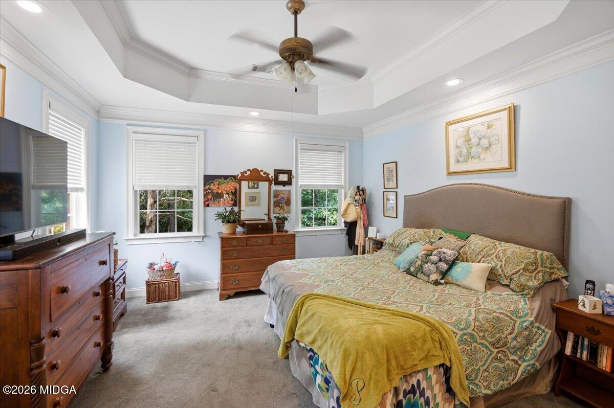 210 Oberon Place Macon, GA 31210 - Photo 17 of 31 a bedroom with a large bed and a flat tv screen on dresser