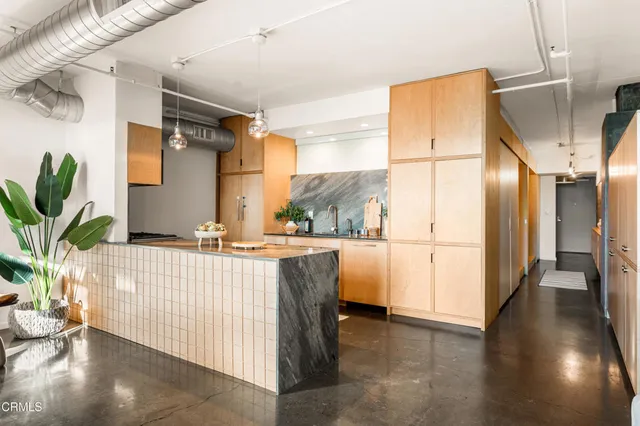 a dining room with furniture a rug and wooden floor