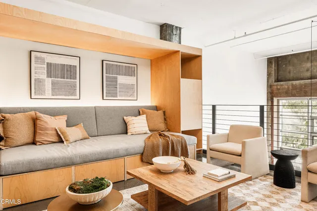 a spacious bedroom with a bed and a window