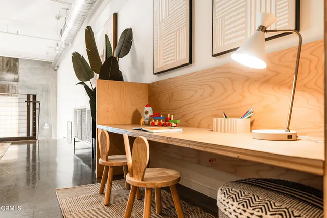 a bedroom with a bed and a table in it