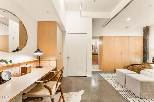 a bathroom with a granite countertop sink mirror and a shower