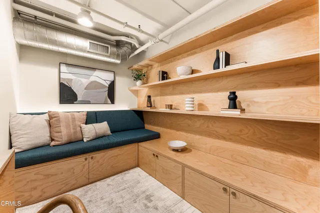 a view of a living room with a rug