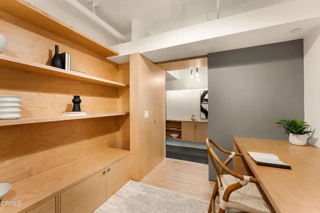 a bedroom with furniture and a potted plant