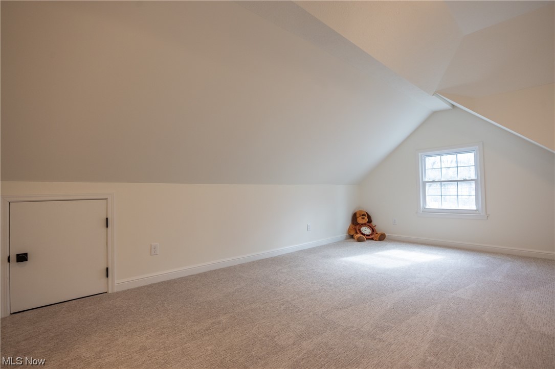 32887 Cedar Road Mayfield Heights, OH 44124 - Photo 26 of 44 Bonus room with lofted ceiling and light carpet