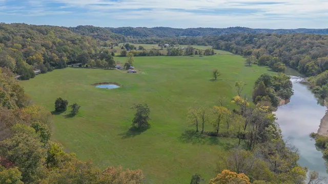 an aerial view of a houses with a lake view