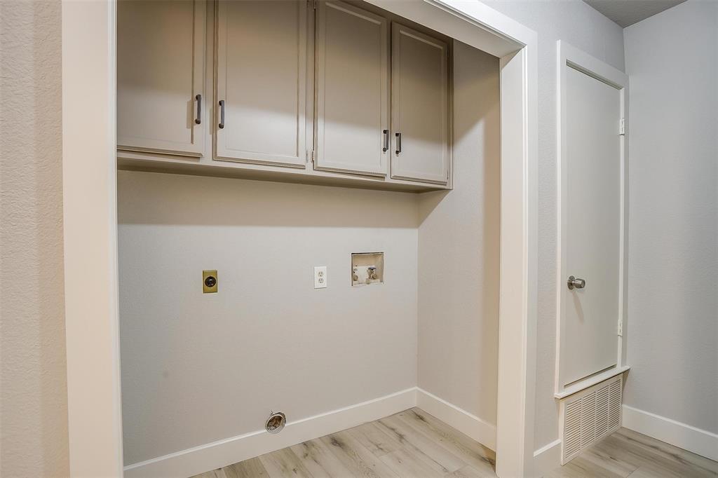 10311 Lone Pine Lane Fort Worth, TX 76108 - Photo 12 of 13 a view of cabinets and wooden floor