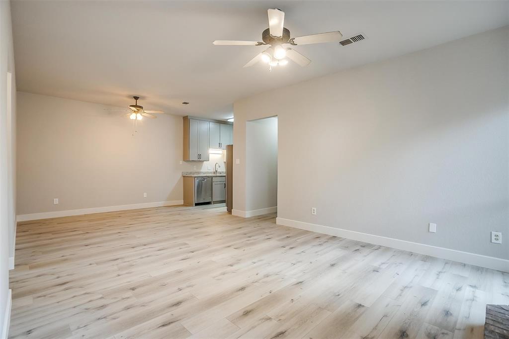 10311 Lone Pine Lane Fort Worth, TX 76108 - Photo 4 of 13 wooden floor in an empty room with a window
