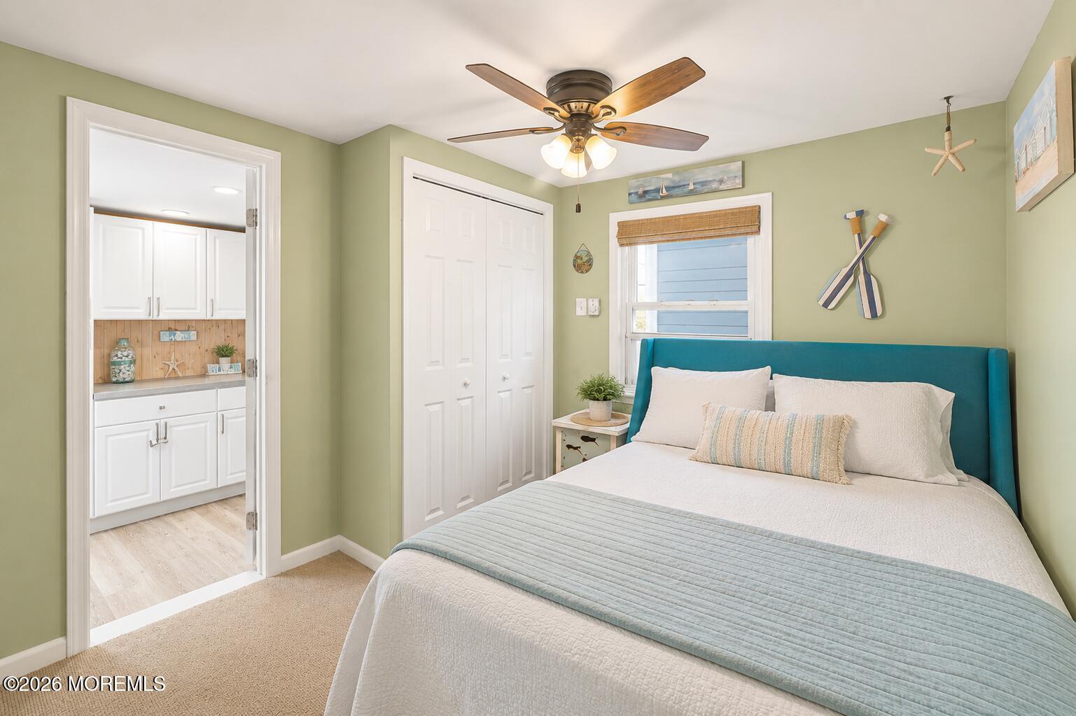 246 Cove Road Newport, NJ 08345 - Photo 11 of 21 a bedroom with a large bed and a chandelier