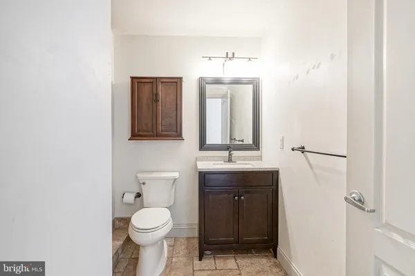 a bathroom with a shower and toilet
