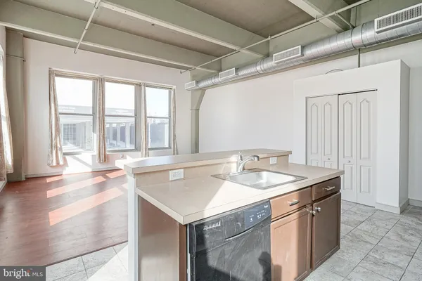 a view of storage and utility room with washer and dryer