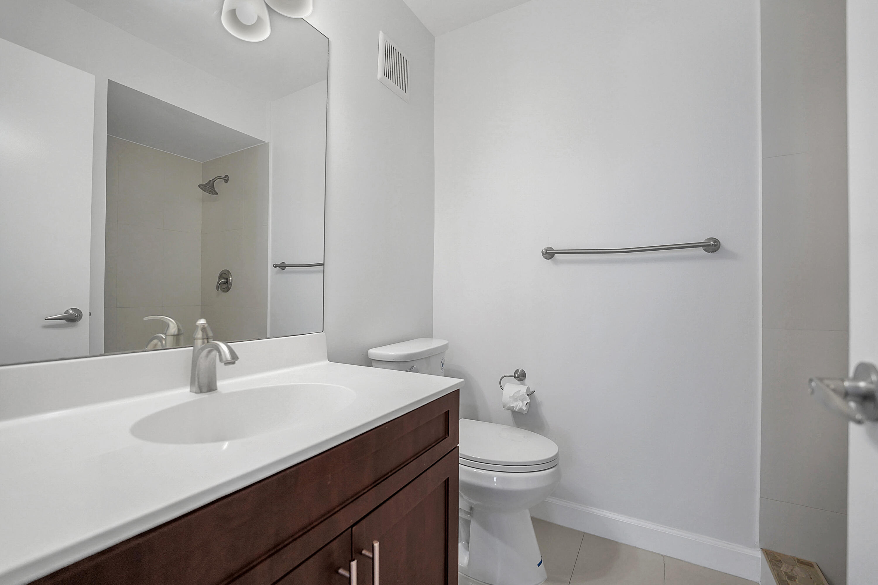4550 Southwest 68th Ct Circle, Unit 548 Miami, FL 33155 - Photo 14 of 51 a bathroom with a sink toilet and vanity